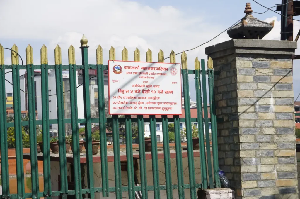 Kathmandu Metropolitan Notice Board about Opening Time and CCTV surveillance at Rani Pokhari
